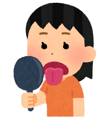 舌を鏡で見る女性